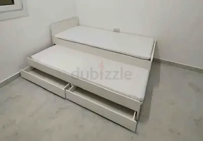 Ikea slakt bed frame with under bed and 2 storage drawers underneath with 2 Ikea mattresses is avail