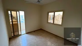 2BR apartment for annual rent in Conquer Tower on Khalifa St, open view, balcony, 3 baths, central A