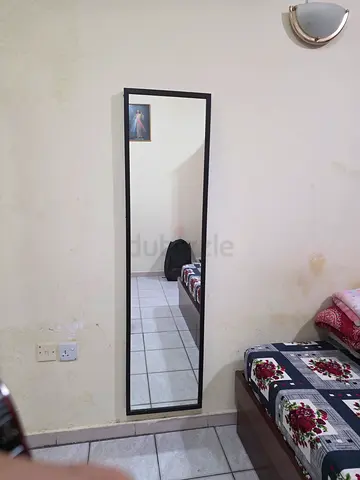 Full-length black-framed wall mirror - used