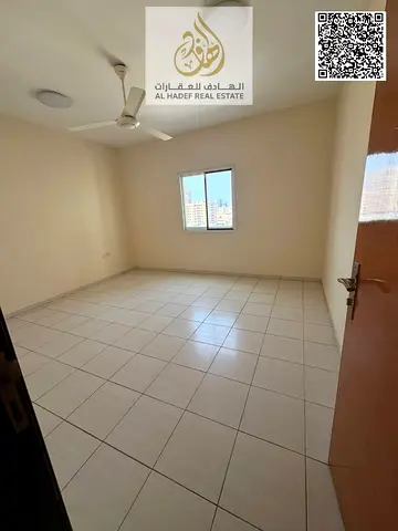 Two-bedroom apartment with a separate living room – balcony with an open view – Al Naeemia, near Gulfa Bridge