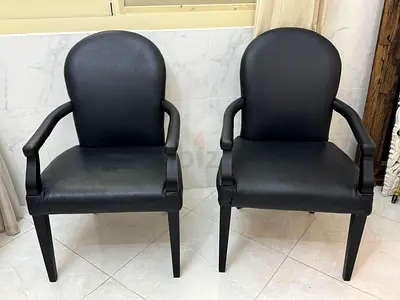 The One Elegant Black Leather Arm Chairs