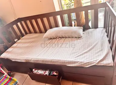 Wooden single daybed with under-drawer storage along with mattress
