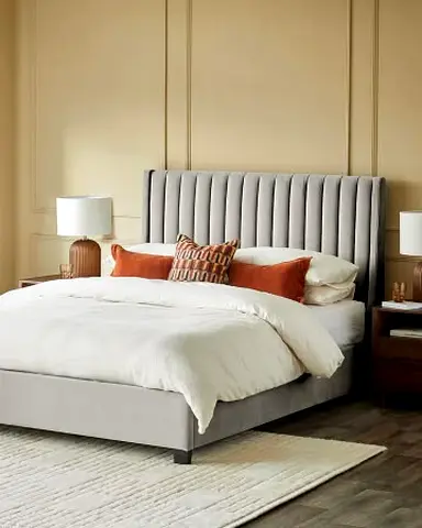 Grey upholstered bed frame with channel headboard