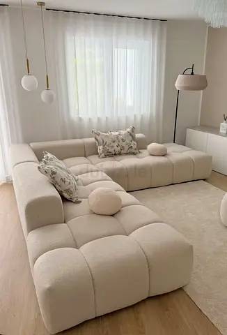 Cream bouclé modular tufted sectional sofa (L-shaped)
