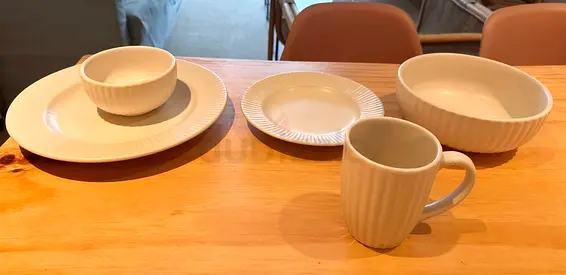 White ribbed ceramic dinnerware set — plates, bowls  mug