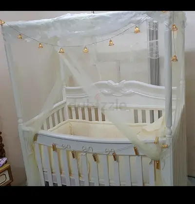 White wooden baby crib