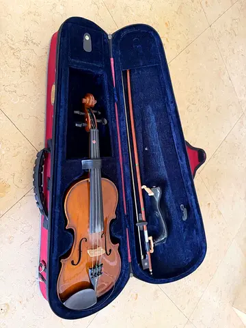 Violin (1/2 size) with case and bow - good condition