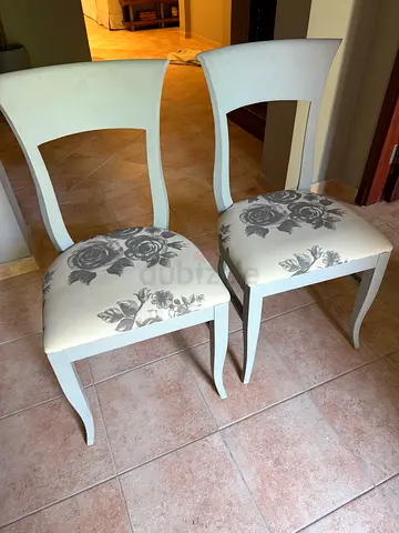 Set of 2 white wooden dining chairs with gray floral upholstery