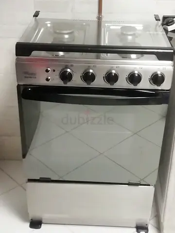 Super General 4-burner stainless steel gas cooker with oven - used, working