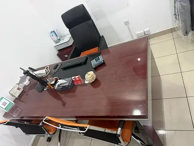 Executive wooden desk with high-back leather chair