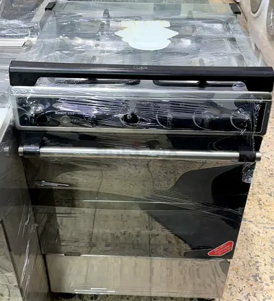 Freestanding stainless steel cooker with oven — wrapped, good condition