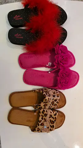Three pairs of womens slippers — fluffy pink, red feather and leopard slides, gently used