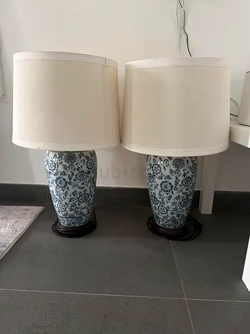 Pair of blue-and-white ceramic table lamps with shades cream in colour
