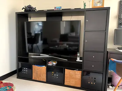 My black TV cabinet unit with shelves and storage