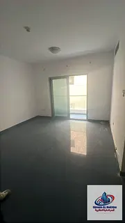 For annual rent in Sharjah, Al Qulaya area: 3 bedrooms, a living room with 2 balconies - open view -