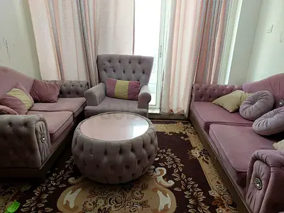 My mauve tufted 3-piece sofa set with round ottoman