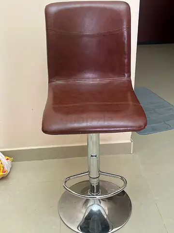 Pan Emirates Metal High Chair featuring adjustable height and brown upholster