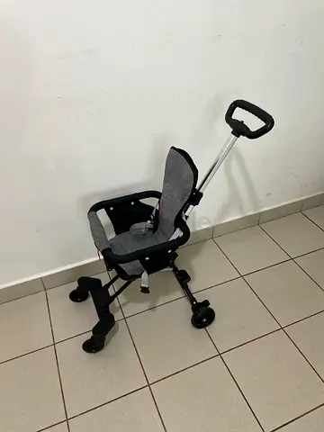 My compact foldable stroller with parent push handle