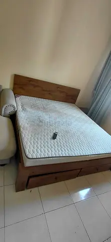 Bed with mattress and side tab