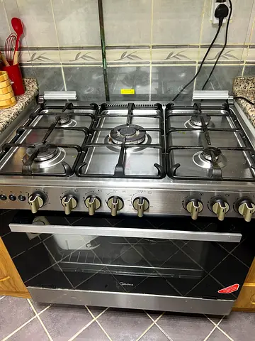 5-burner stainless steel gas cooker with oven - used, good working condition