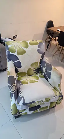 Floral-patterned upholstered armchair - good condition