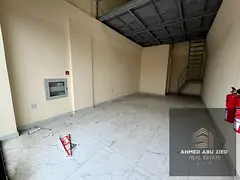 Commercial space with a mezzanine for rent in Al Jurf 1, Ajman | Prime location opposite Al Aqsa Sch