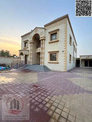 For sale: Villa in Ajman Al Rawda 3 with an area of 10,000 sq. ft., 5 master bedrooms, a majlis, a living room, and a maid's room. Freehold ownership