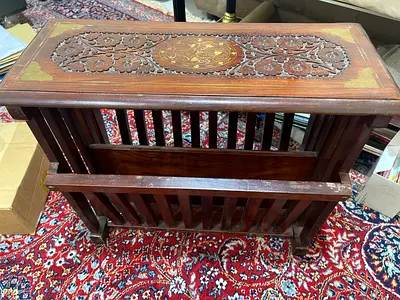 Hand-carved wooden magazine rack side table with brass inlay