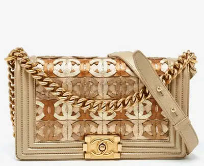 Authentic Chanel Gold CC Cut Out Leather Medium Boy Bag