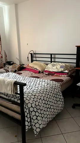 Black metal double bed frame with mattress — used, good condition