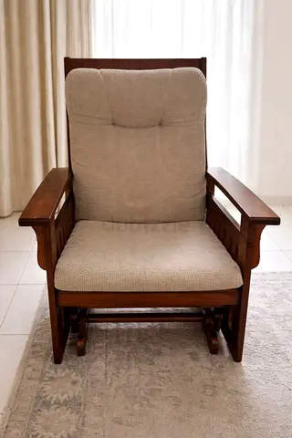 wooden glider rocking chair with beige cushions