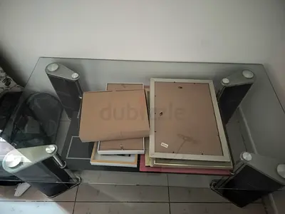 Glass coffee / TV table with metal pillars