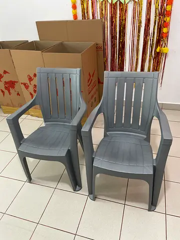 Two grey plastic armchairs — used, good condition