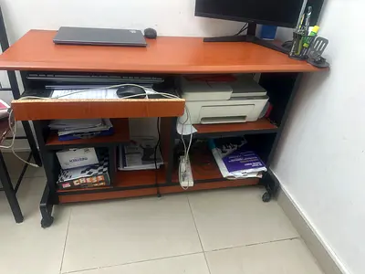 Wooden computer desk with shelves, drawer and caster wheels - used.