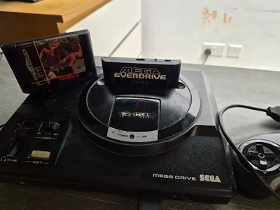 Sega Mega Drive Console + 2 Controllers + 2 Games