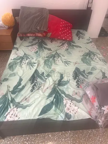 Single wooden bed frame with headboard and mattress — includes floral bedding