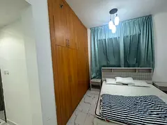 Two bedrooms and a living room for annual rent in Al Waha Towers, Ajman, with a sea view, two balcon