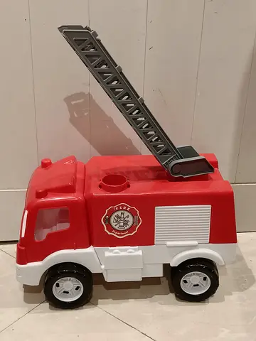 My childs red toy fire truck with extendable ladder