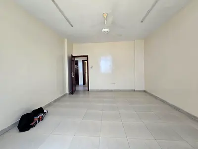 Spacious 2BR & Hall | Directly on Sheikh Ammar St | 2 Baths & Energy-Saving AC | Al Rawda 3