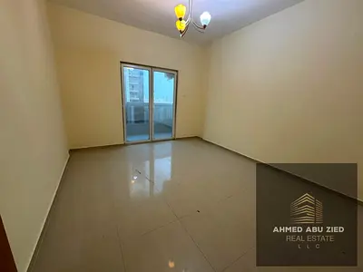 Two bedrooms with living room for rent in Al Nuaimiya 3 Ajman Khalifa Street, balcony open view, family tower, free maintenance, 4 installments