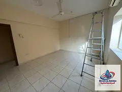 Apartment for annual rent: two bedrooms, a living room, a balcony, and two bathrooms in the Al-Rawla