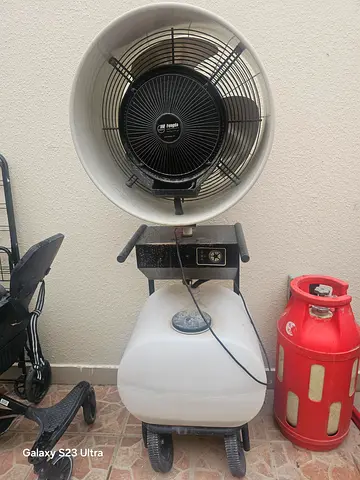Portable evaporative misting fan on wheels
