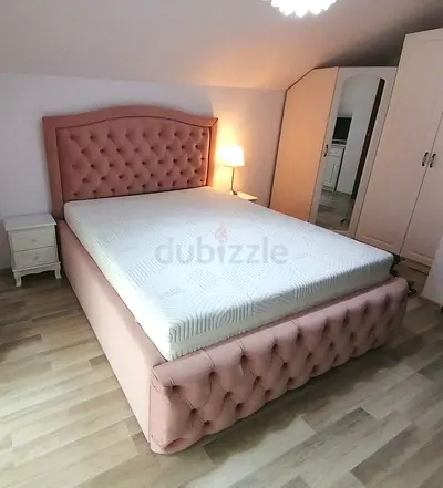Elegant Pink Bed with Headboard