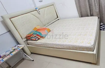 My cream upholstered bed with mattress - good condition