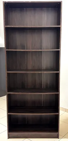 My dark wood 7-shelf bookcase — good condition
