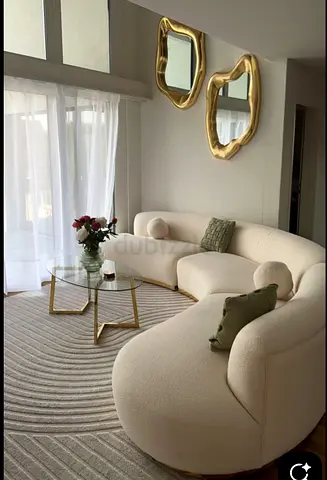 Curved cream bouclé sofa — comfortable lounge