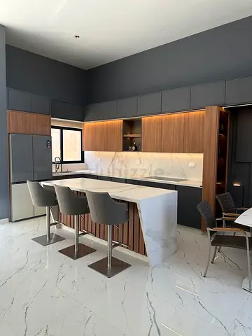 Modern kitchen island with marble-look countertop