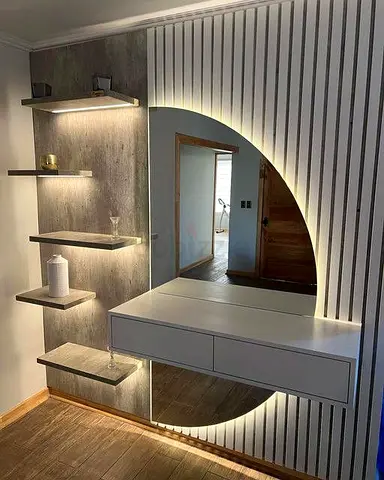 Floating wall vanity with LED backlit round mirror and shelves