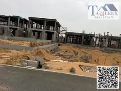 Land for sale in Al Helio 2, Ajman, close to the main street. A residential plot for ground and two