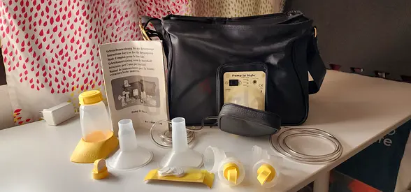 Electric breast pump with full set of accessories and carry bag